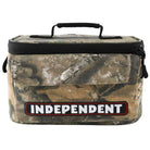 Camo-patterned rectangular bag with a black top handle and zipper, featuring a bold INDEPENDENT bar logo patch on the front over a red and black background—this Bar Logo 5 Liter Independent x Realtree Cooler Unisex is the perfect REALTREE APX insulated cooler for fans of Independent Trucks accessories.