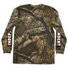 The Bar Logo Realtree APX Longsleeve Midweight T-Shirt features a forest camo pattern and bold white INDEPENDENT lettering on black panels down both sleeves.