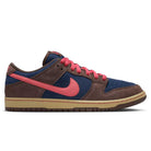 The Baroque Brown Adobe Midnight Navy Dunk Low Pro HQ1625200 Nike SB suede shoes feature dark blue panels, brown suede overlays, a light brown sole, bright pink Swoosh, pink laces, and matching pink accents on the tongue and heel.