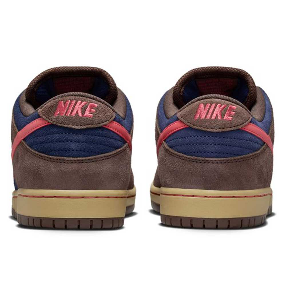 The Baroque Brown Adobe Midnight Navy Dunk Low Pro HQ1625200 Nike SB Suede Shoes feature brown suede, navy blue panels, red accents, and red "NIKE" embroidery on the heels with tan rubber soles.