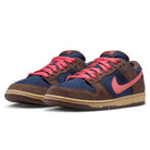 The Baroque Brown Adobe Midnight Navy Dunk Low Pro HQ1625200 Nike SB Suede Shoes feature brown suede overlays, navy panels, pink laces and swoosh, with a beige and brown rubber sole.