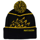The Beanie Eagle Pom Black Yellow by Anti Hero Skateboards is a black knit beanie with yellow accents, a classic pom-pom top, zigzag yellow flame patterns, and bold ANTIHERO text embroidered in yellow on the front cuff—a standout accessory for any collection.