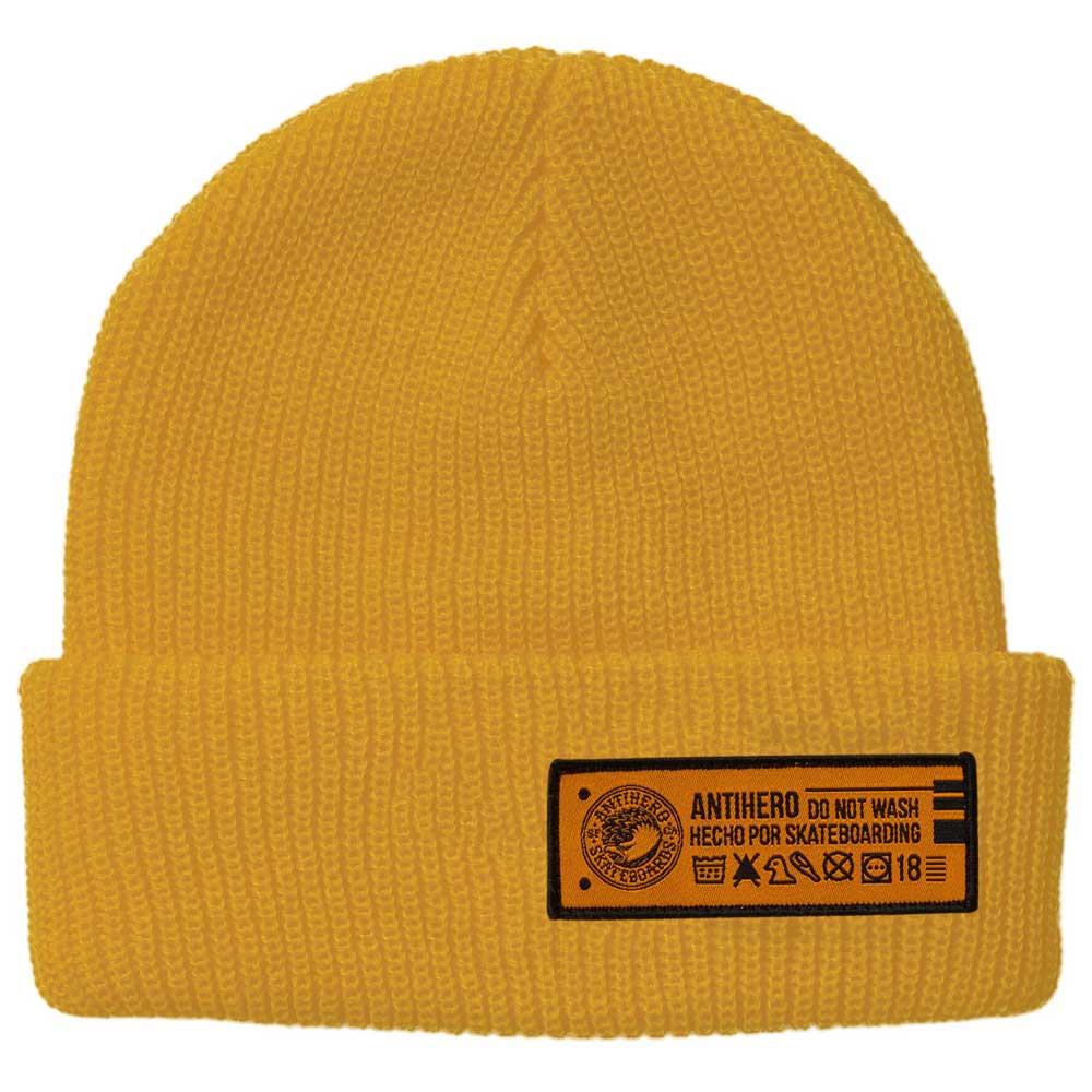 The Beanie Hecho Por Skateboarding Cuff Yellow from Anti Hero Skateboards is a yellow knit beanie featuring a black rectangular patch with care instructions, branding, and the text “ANTHERO” and “DO NOT WASH HECHO POR SKATEBOARDING,” embodying the bold spirit of Anti Hero Skateboards.