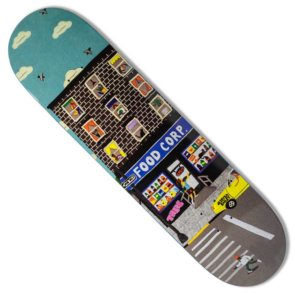 The Bev Break Jessyka 8.12x32 There Skateboards Deck features vibrant city street art—a “Food Corp” grocery, apartment windows with people and pets, a yellow taxi, crosswalk, and a lively blue sky with clouds and birds by Jessyka.