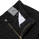 Close-up of the waist and open zipper of Bighead Fill Denim Pant Black Spitfire Wheels, featuring a metallic button, white inner lining, and a black-and-white swirled label with "32," echoing Spitfire Wheels' iconic design.
