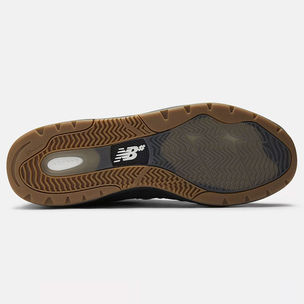 The image shows the sole of the Black 933 NAP New Balance Numeric Suede Skateboarding Shoes with a gum rubber tread, grip-enhancing textured patterns, a white New Balance logo at the midfoot, and “NDurance” branding on the heel.