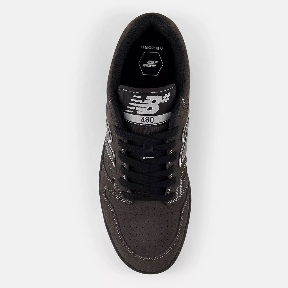 Top view of the Black Cement 480 CSS New Balance Numeric suede skateboarding shoe, featuring white and silver accents, black laces, “NB 480” on the tongue, visible stitching, and a perforated toe box inspired by heritage basketball styles.