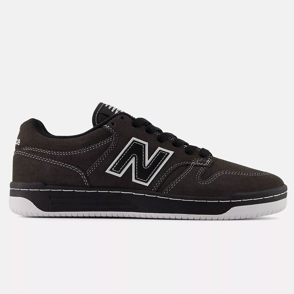 The Black Cement 480 CSS New Balance Numeric Suede Skateboarding Shoes feature black suede, white stitching, a white N logo, black laces, and a white rubber sole, displayed in side profile against a plain white background.