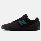 The Black Cement New Spruce 508 TAC New Balance Numeric Suede Skateboarding Shoes feature a black and dark gray design with a teal N logo, black laces, and sole—inspired by Brandon Westgate’s signature style, shown side-on against a white background.