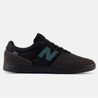 The Black Cement New Spruce 508 TAC New Balance Numeric Suede Skateboarding Shoe, created with Brandon Westgate, features a teal N logo, perforated toe, black laces and sole, all shown in side profile on a light background.