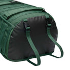 Close-up of the bottom end of the Black Fir FD7544323 Nike SB RPM Skate Backpack, featuring a green base with a black panel and two green adjustable straps attached with black buckles. This skateboard backpack showcases textured fabric, reinforced stitching, and a durable design crafted for skateboarding.