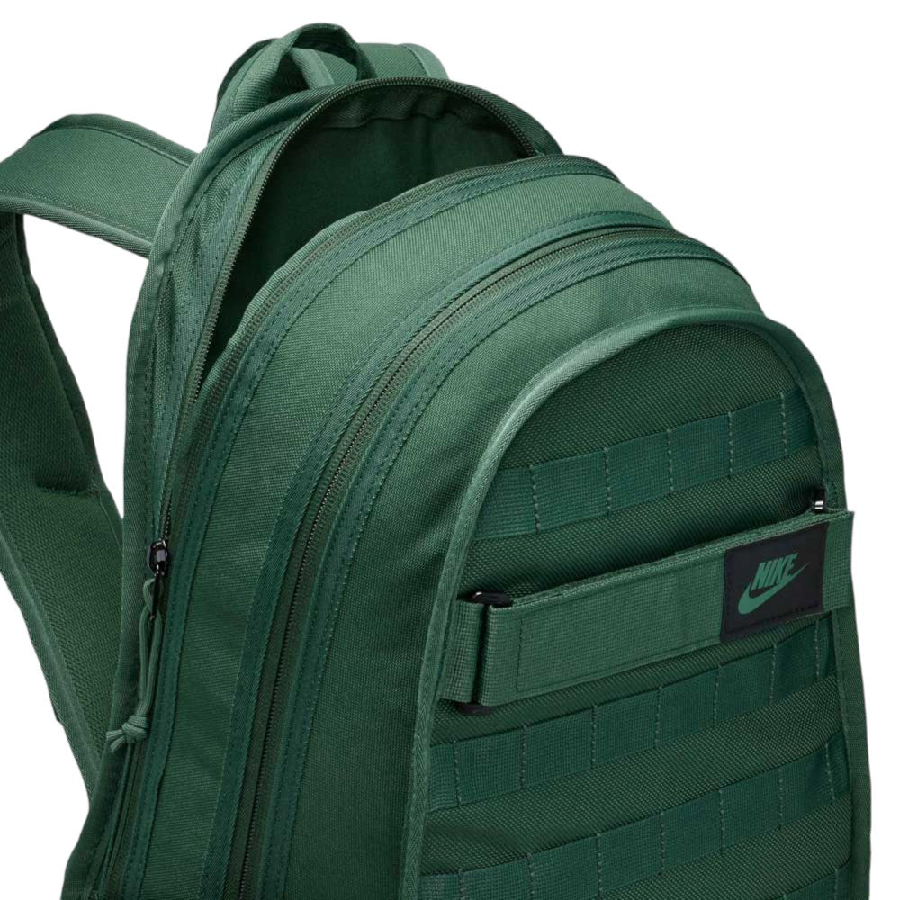 Close-up of the Black Fir FD7544323 Nike SB RPM Skate Backpack, featuring multiple zippered compartments and a front Nike logo patch, designed as a water-resistant backpack ideal for skateboard enthusiasts.