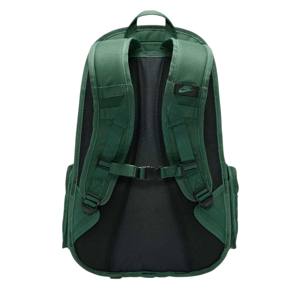 The Black Fir FD7544323 Nike SB RPM Skate Backpack is shown from the back in green and black, featuring padded shoulder straps, a chest buckle, and a top handle. The Nike SB logo appears on one strap, showcasing both style and the practical functionality expected from this quality skateboard backpack.