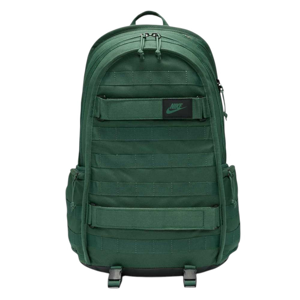 A black Nike SB RPM Skate Backpack (model Fir FD7544323) with multiple compartments, horizontal webbing, a top handle, and side pockets is displayed against a plain white background. This versatile skateboard backpack is designed to keep your gear organized and secure.