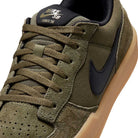 Close-up of Black Medium Olive IQ8398200 Force 58 Nike SB Suede Skateboarding Shoes, featuring a suede and canvas upper, black Nike logo, brown laces, perforated toe, and a light brown gum cupsole for classic skate style.