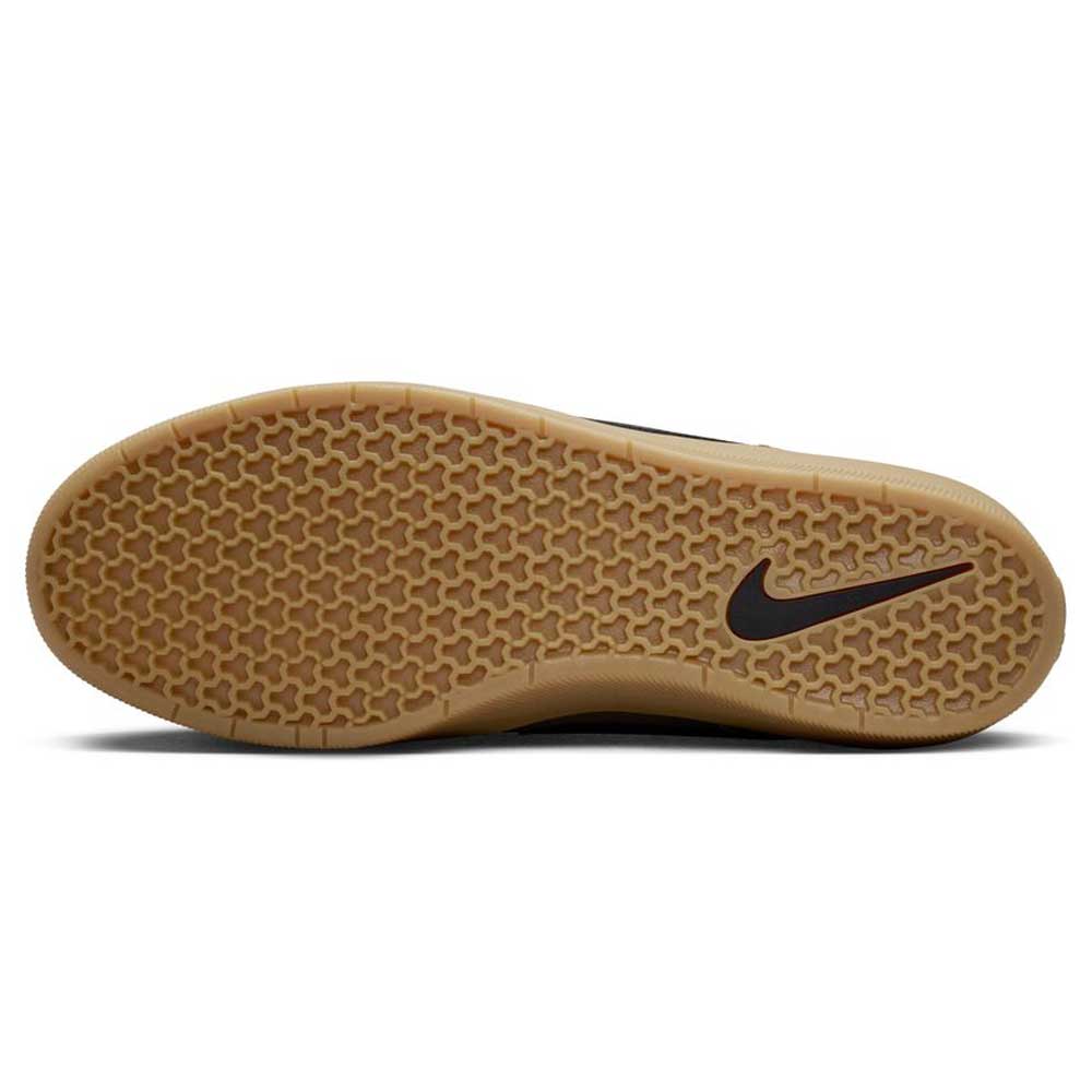 The image shows the sole of the Black Medium Olive IQ8398200 Force 58 Nike SB Suede Skateboarding Shoes, featuring a light brown honeycomb tread and a black Swoosh, reflecting basketball-inspired design elements.