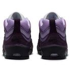 The Black Noble Purple IR1887500 Air MAX Ishod Nike SB Skateboarding Shoes feature a purple gradient upper inspired by Air Max Ishod, visible Nike SB logos on the back, and dark soles.
