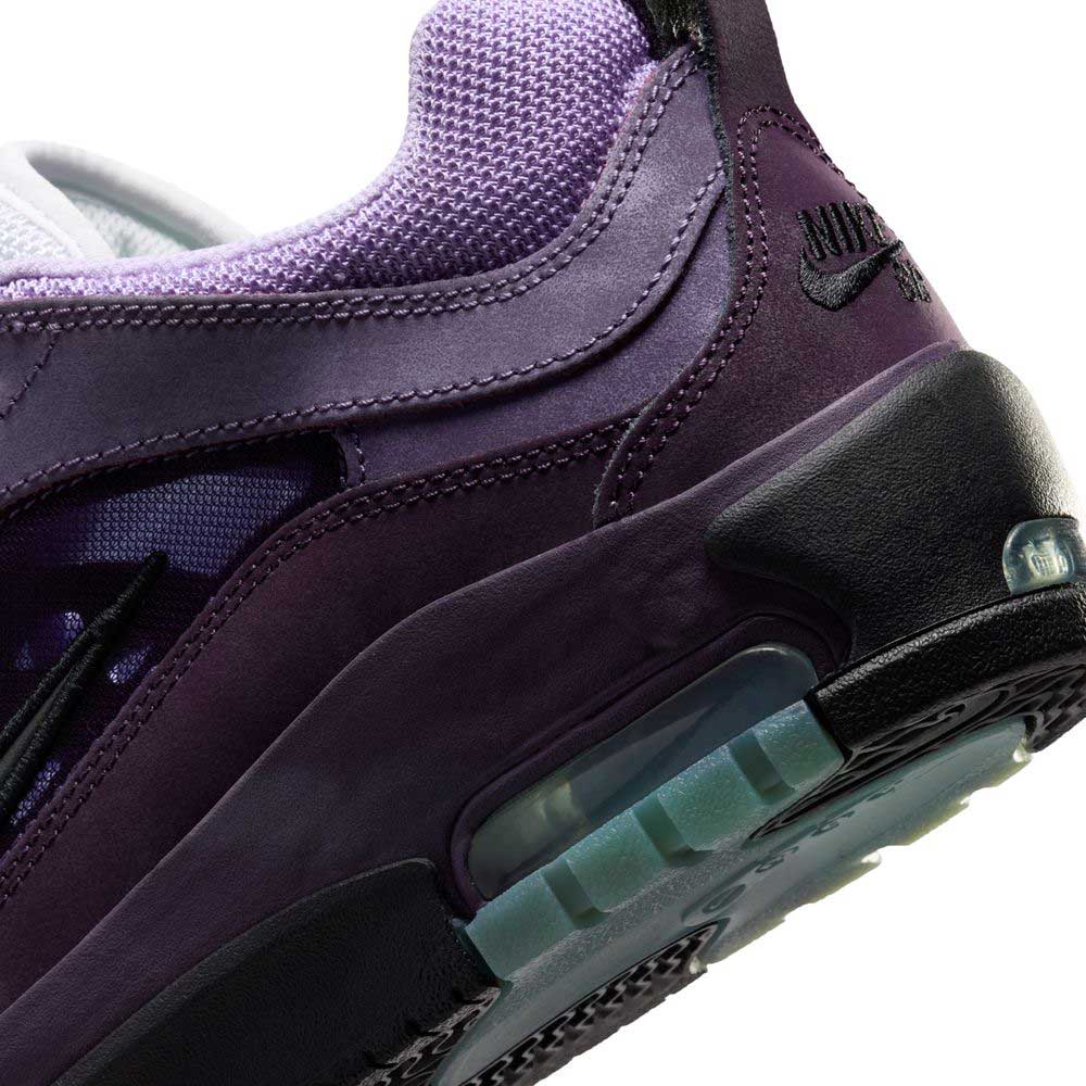 Close-up of Black Noble Purple IR1887500 Air MAX Ishod Nike SB skateboarding shoe, highlighting its textured upper, gradient purple tones, signature Swoosh logo, visible Max Air cushioning, and a clear outsole section.