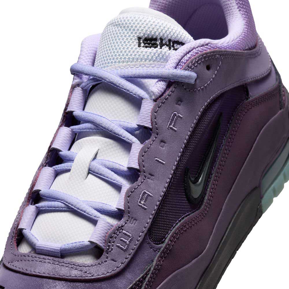 Close-up of the Black Noble Purple IR1887500 Air MAX Ishod Nike SB Skateboarding Shoe, featuring a black swoosh, white tongue, lilac laces, and 'AIR' on the suede-mesh side panel that highlights its signature Max Air cushioning.