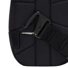 Close-up of a Black Reflect Silver IQ1279010 Nike SB RPM Skate Backpack, showcasing its black fabric construction with a thick strap and a black plastic buckle featuring a hook. The backpack displays visible stitching and includes a small pocket on the left side.