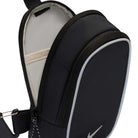 Close-up of the Black Reflect Silver IQ1279010 Nike SB RPM Skate Backpack, featuring a black exterior with a white swoosh logo, an open compartment revealing a beige inner pocket, and an attached black strap. No additional product description is provided.