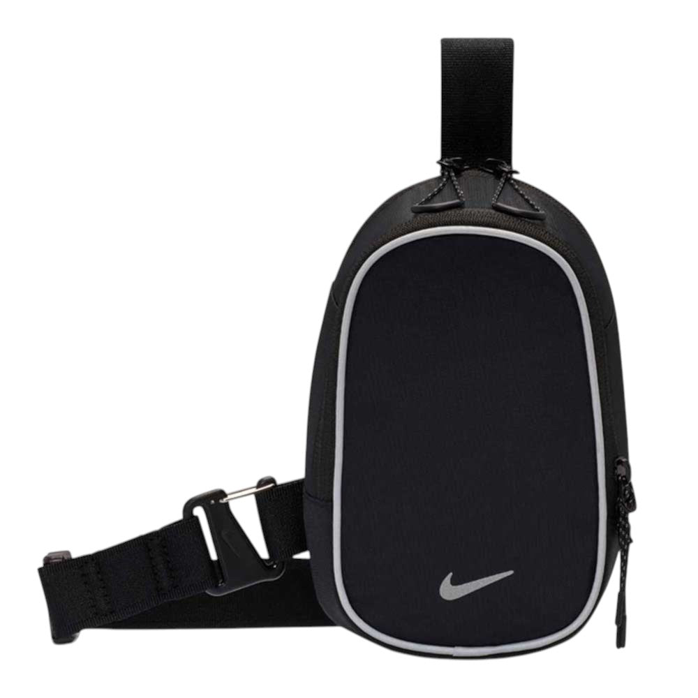 A black Nike SB RPM Skate Backpack (model: Reflect Silver IQ1279010) featuring reflective silver details, adjustable straps, and the iconic white Nike swoosh logo on the lower front—no manufacturer’s description available.