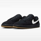 A pair of Black Summit White Code 58 IB0108001 Nike SB Skateboarding Suede Shoes, featuring black suede uppers with white swooshes and light brown gum soles, displayed on a white background—these sneakers combine a classic look with the durability essential for skateboarding.