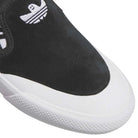 Close-up of the Black White Shmoofoil Slip RX HQ4720 Adidas Skateboarding Suede Shoes, featuring a black and white upper, suede texture, white Trefoil Shmoofoil logo, and a textured white rubber sole—classic for adidas skate fans.