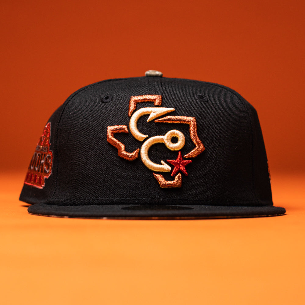 Show off your Corpus Christi Hooks pride with the Hooked in Camo New Era 5950 Fitted Hat—this stylish black baseball cap features an embroidered Texas outline with interlocking Cs and a red star on the front, all set against an orange background.