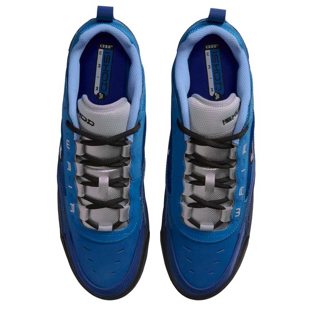 Top view of Blue Void Metallic Silver IR1887400 Air MAX Ishod Nike SB skateboarding shoes with black and white laces, gray tongue, black soles, and insoles featuring bold blue and yellow branding.