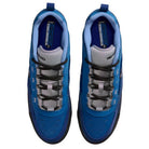 Top view of Blue Void Metallic Silver IR1887400 Air MAX Ishod Nike SB skateboarding shoes with black and white laces, gray tongue, black soles, and insoles featuring bold blue and yellow branding.