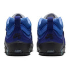 Back view of Blue Void Metallic Silver IR1887400 Air MAX Ishod Nike SB Skateboarding Shoes with black soles. Features mesh and suede uppers, Max Air cushioning on the heels, and visible Nike SB logo for comfort and style.