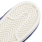 Close-up of a white sole with a herringbone tread pattern and part of the blue upper along the edge, highlighting the classic design details of the Blue White KJ5113 Superstar Adidas Skateboarding Suede Shoes Footwear.