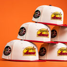 Five Poppa Burger Bo Bundy 35th Houston Astros Bo New Era Hat 5950 Fitted caps are stacked in two rows against an orange background. Each cap features the Astros logo and a commemorative side patch.