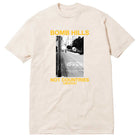 Bomb Hills Not Countries Off White GX1000 Tee Yellow Font showcasing a black-and-white street photo, highlighted by bold yellow “BOMB HILLS NOT COUNTRIES GX1000” text above and below the image.