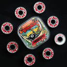 A set of eight Bronson Speed Co. Skateboard Bearings Erick Winkowski Pro G3 in red and white are displayed around a square tin with colorful artwork, cartoon character, and Krooked, Bronson, and Erick Winkowski Pro text on a black background.