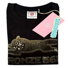 The Bronze 56K x Ice Cream Wunning Dog Tee Black features a metallic wildcat graphic with BRONZE 56K text and a pink ICECREAM tag on the collar.