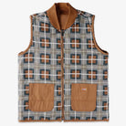 The Brown Duck Vest Thrasher Magazine x Dickies Skateboarding A88IT 0BD features a relaxed fit, geometric pattern in gray, blue and brown, two large brown front pockets, and a front zipper closure for comfort and style.