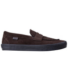 The Skate Loafer Vans VN000VA6Y491 Brown Black Suede Skateboarding Shoes feature a brown suede slip-on design, black rubber sole for grip and impact protection, visible stitching, and a side fabric tag—shown on a plain white background.