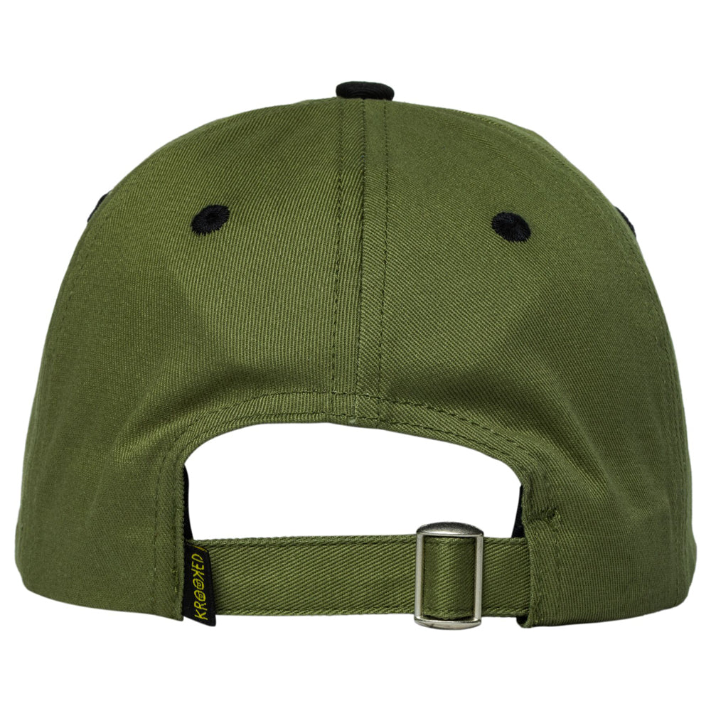 Olive green Brushskript Snap Off Olive Black Krooked Skateboards Adjustable Strapback Hat with black accents and a small branded tag on the adjustable rear strap.