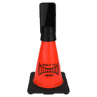 The Built to Grind Independent Phone Cone, inspired by the iconic Independent Trucks mantra and featuring “BUILT TO INDEPENDENT GRIND” printed on its orange surface, securely holds a black smartphone vertically at the top. This distinctive accessory serves as both a phone stand and a sturdy display piece with its solid black base.