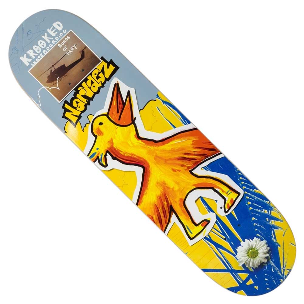 The Burds Narvaez 8.38 Krooked Skateboard Deck features a large yellow bird, a daisy by the tail, and a nose label with text and ship silhouette on a gradient background.