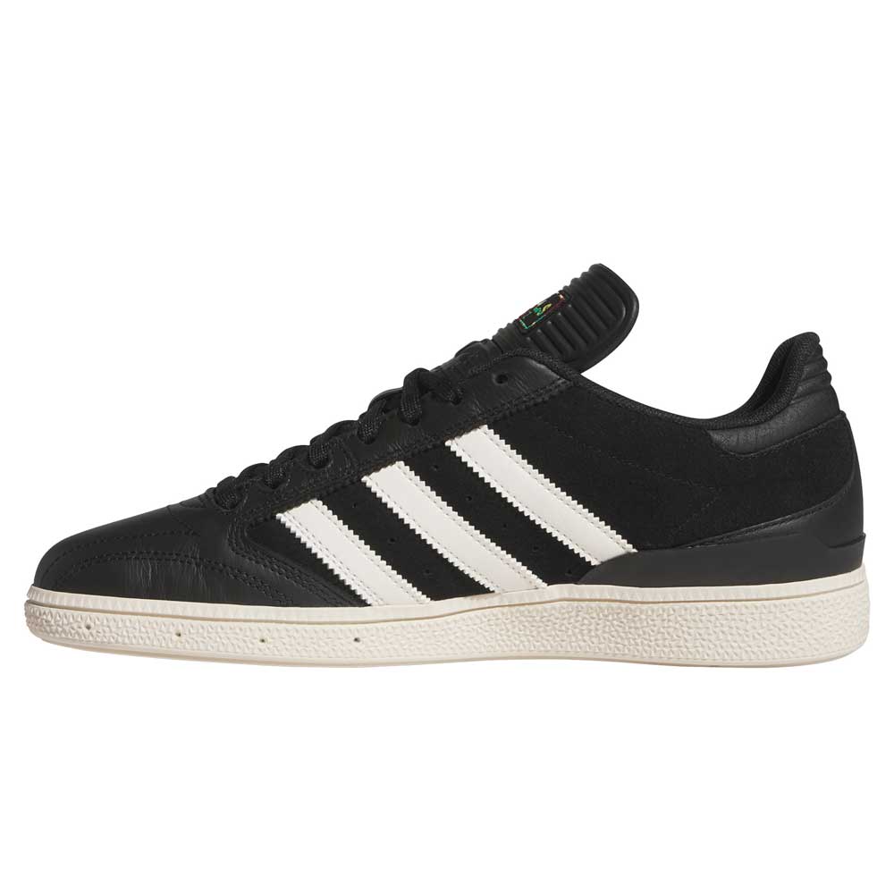 The Busenitz Black White HQ4708 Adidas Skateboarding Suede Shoes feature black suede with white stripes and a white sole, shown from the side against a white background—durable skate shoes inspired by classic Busenitz style.