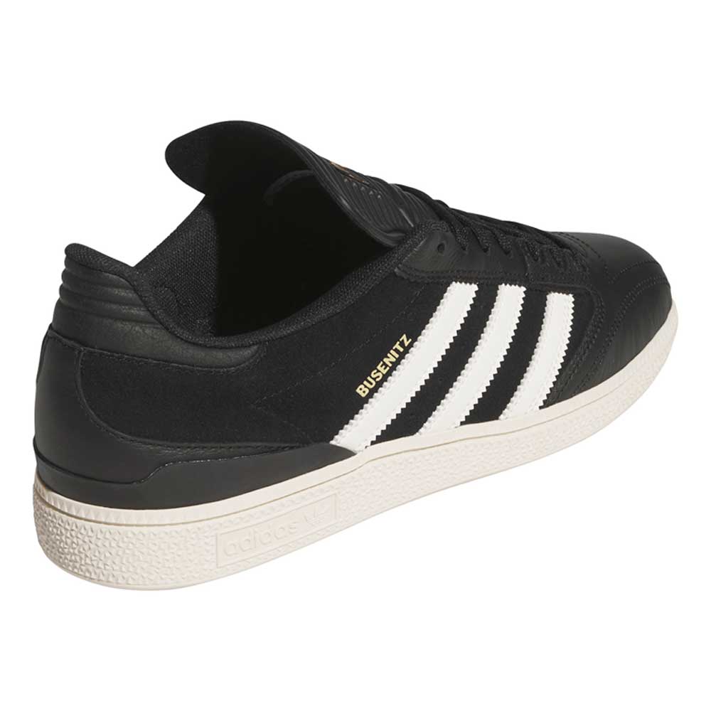 The Busenitz Black White HQ4708 Adidas Skateboarding suede shoes feature black uppers, white stripes, gold BUSENITZ lettering, and a white textured sole—classic durable style for everyday wear.