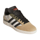 The Busenitz Tan White Black HQ4746 Adidas Skateboarding suede shoe features beige, black, and olive green colors, durable suede construction, white side stripes, black laces, and a red Adidas logo on the tongue.