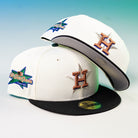 Two Houstatlantavegas Chrome Black Green ASG Houston Astros New Era Hat 5950 Fitted caps are shown: one upright with the H logo and star, the other tilted to display the "All-Star Game" side patch.