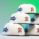 Six Houstatlantavegas Chrome Black Green ASG Houston Astros 5950 Fitted New Era Hats, featuring gold H logos and colorful star patches, are displayed in two stacked rows on a green gradient background.