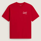 The Caballero VN000XHBIZQ1 Racing Red Short Sleeve Tee from Vans Skateboarding features a loose fit, small white dragon and text on the upper left chest, set against a light beige background.