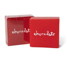 Two Chocolate Ledge Wax Red Square boxes—one in clear plastic, one unwrapped—with "chocolate" in white cursive on the front are displayed against a white background.