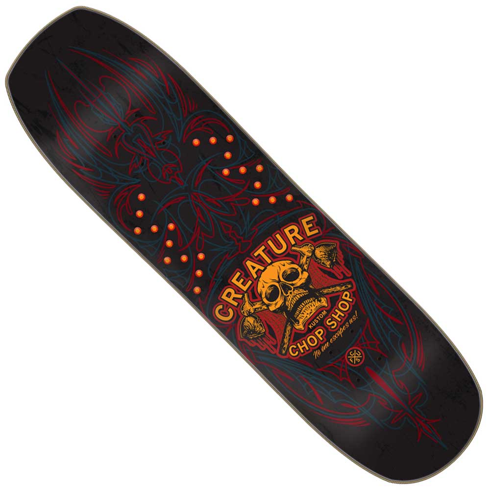 The Chop Shop Pinstripe 8.75in x 32.05in Creature Skateboard Shaped Deck features black pinstripes, red and blue tribal designs, a yellow skull, bold "CREATURE CHOP SHOP" text, and orange truck mounting holes—ideal for any Creature Skateboards fan.